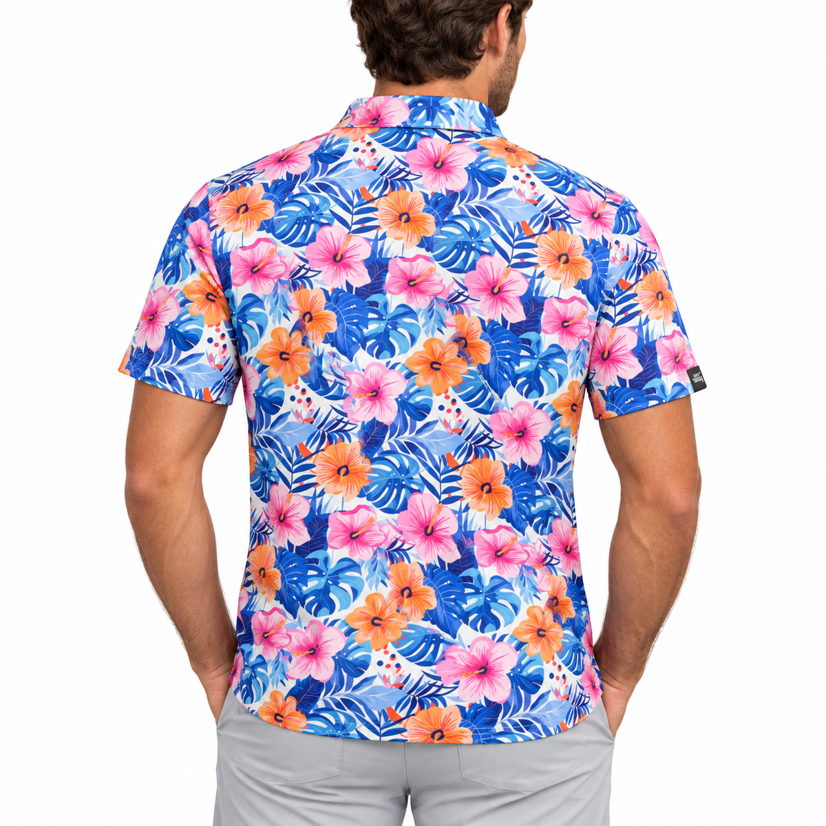 Back of the Birdies in Bloom tropical floral golf polo on a model