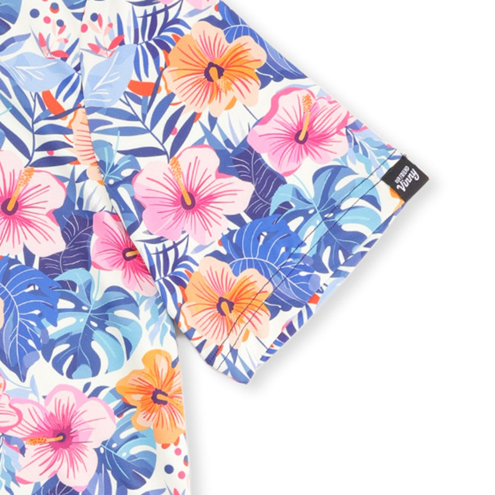Close-up of the Our Friend Vinny tag on the sleeve of the Birdies in Bloom golf polo