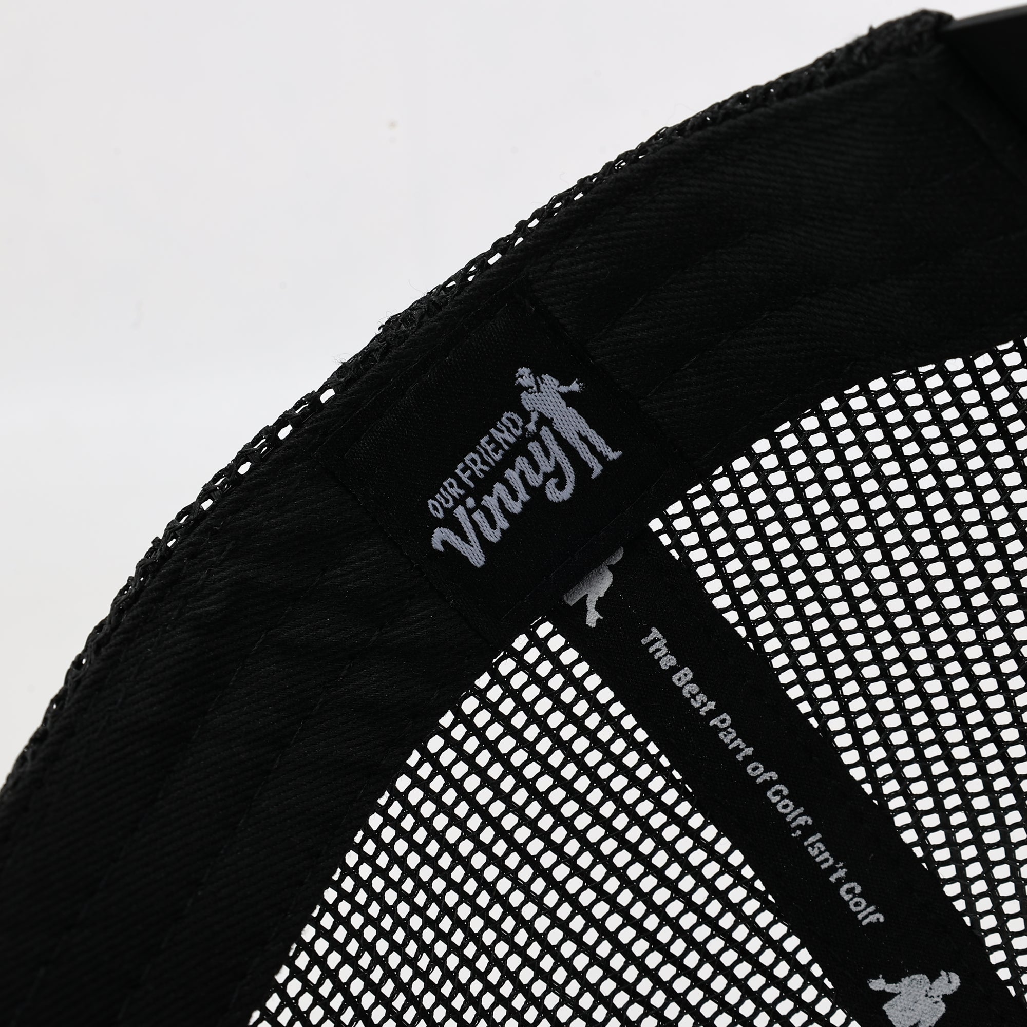 Black mesh golf hat with 'Our Friend Vinny' branding on a white background