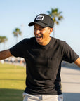 black trucker cap