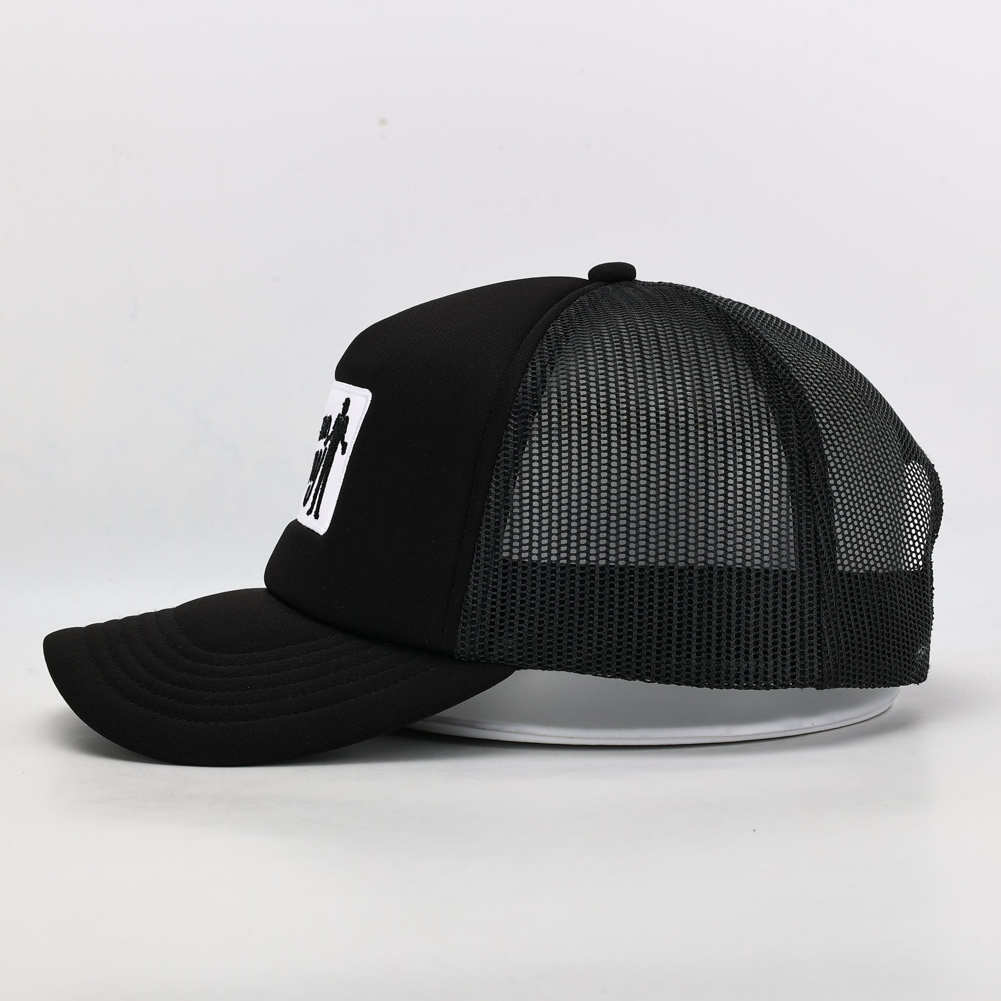 Black mesh cap with a logo on a light gray background