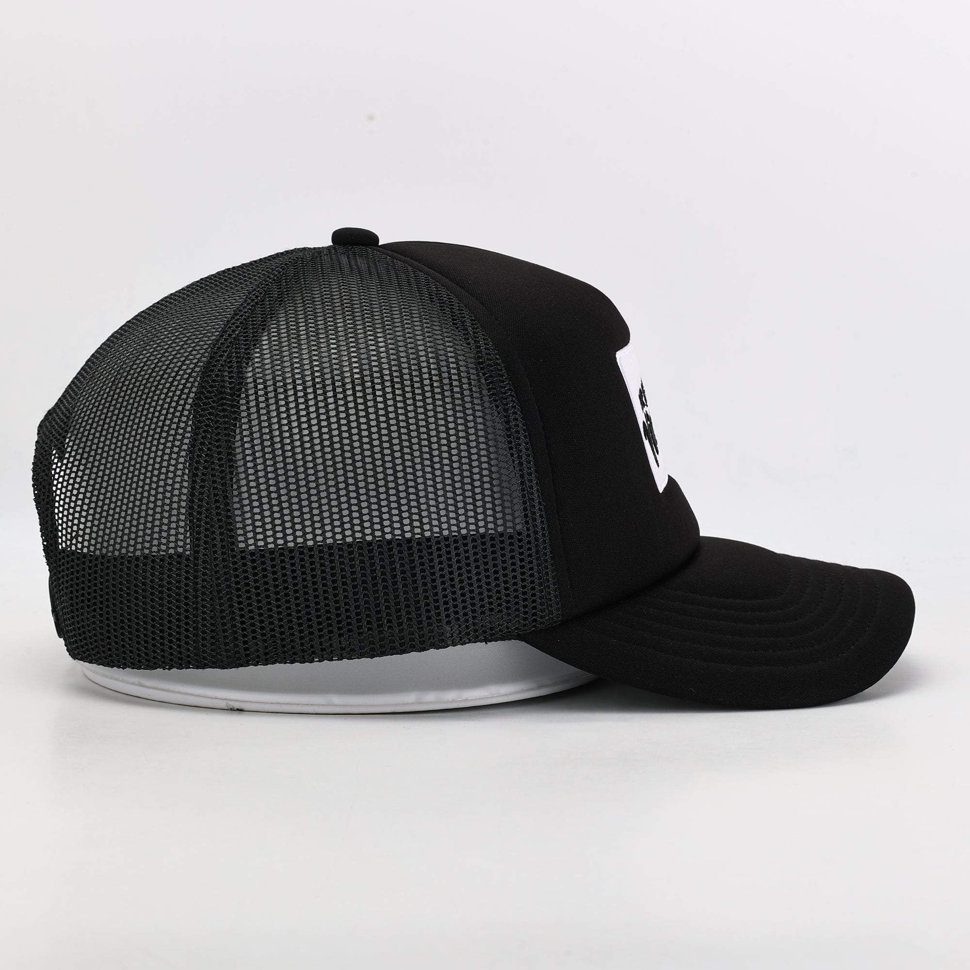 Black mesh cap on a white background