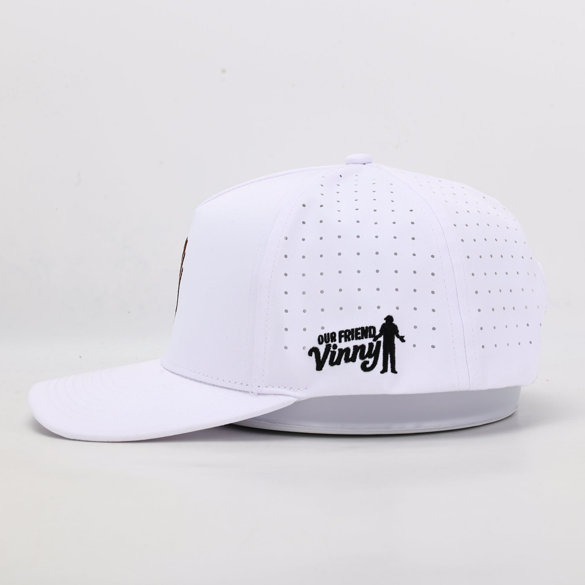 White cap with 'Our Friend Vinny' logo on a light gray background