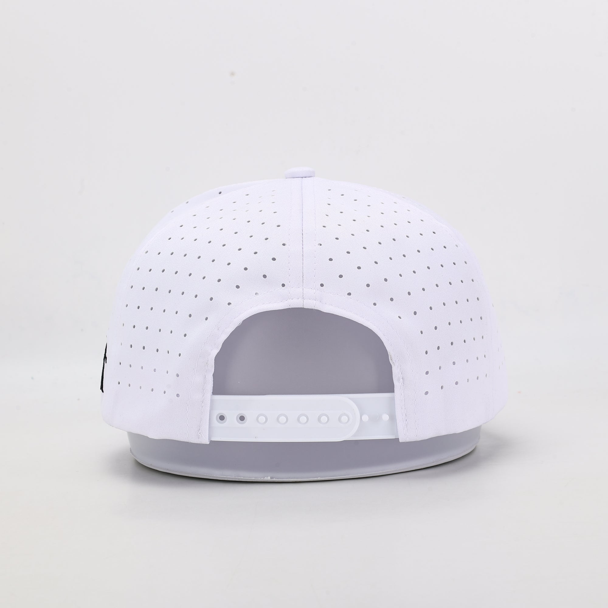 White baseball cap with white brim on a light gray background