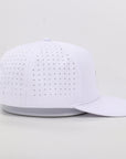 White baseball cap with perforated design on a light gray background