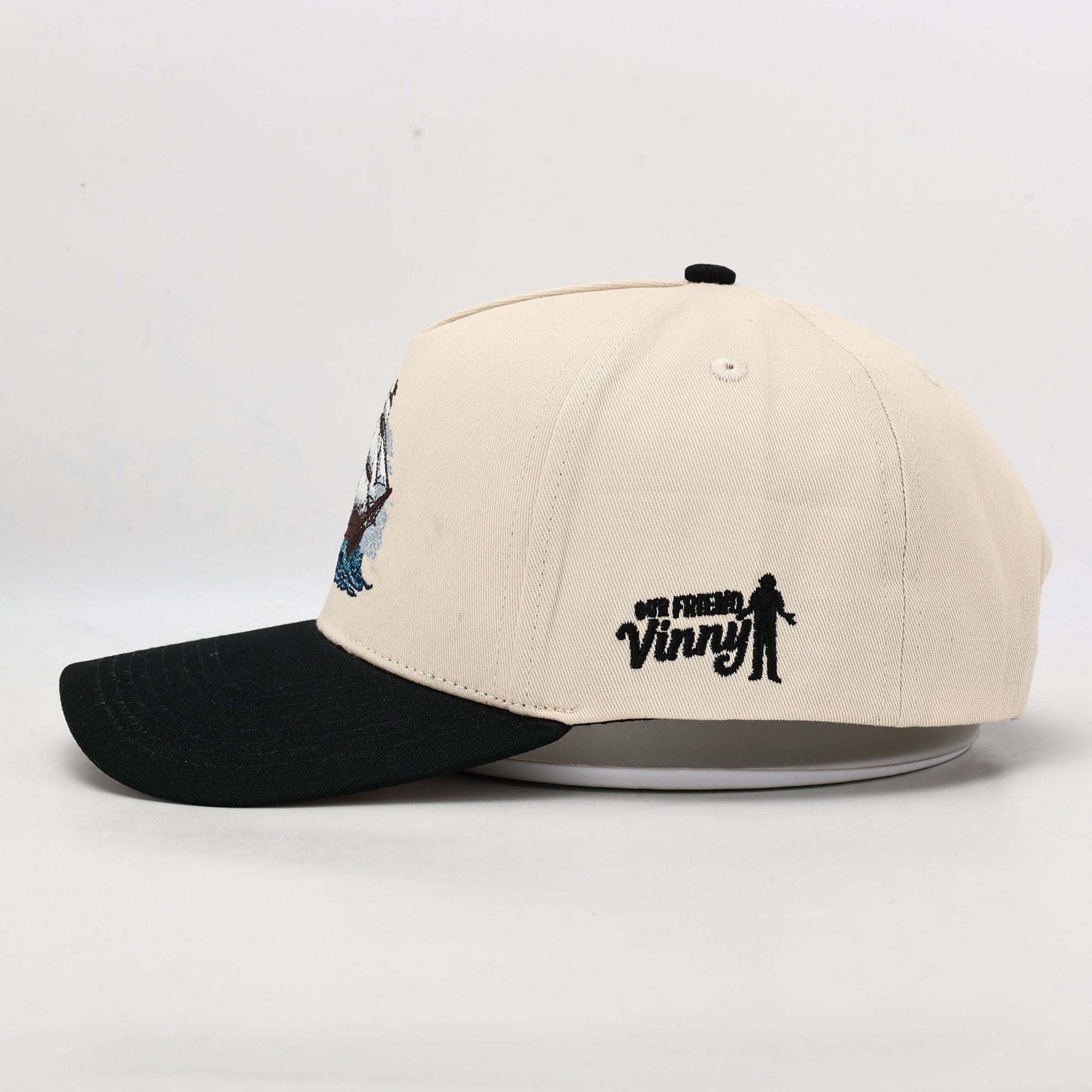 Beige and black cap with 'My Friend Vinny' logo on a white background
