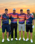 Foursome in matching golf outfits on a golf course with cabin and a sunset in the background