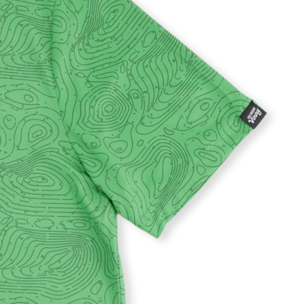 Close-up of the Our Friend Vinny tag on the sleeve of the Green Golf Topography Map golf polo