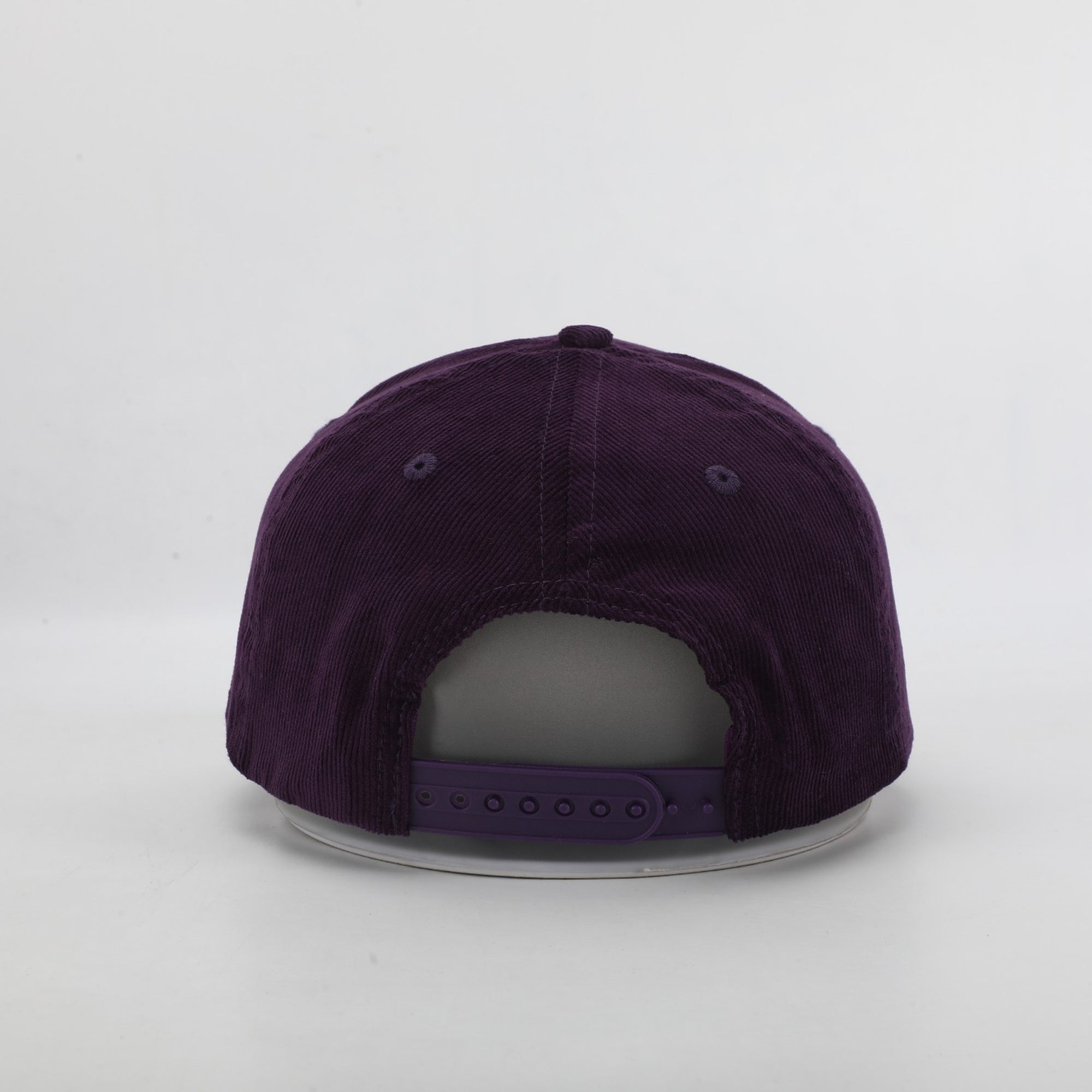 Purple baseball cap on a light gray background