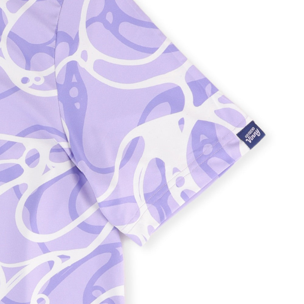 Close-up of the Our Friend Vinny tag on the sleeve of the Riptide golf polo