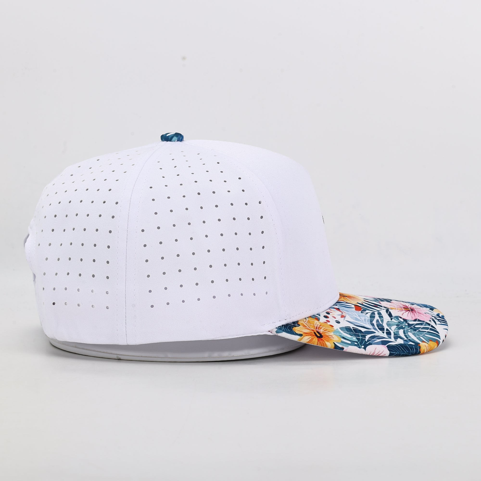 white performance golf cap with floral brim 