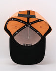 Black and orange cap with brand logo on a white background